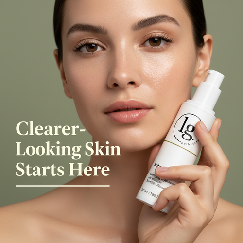 Close-up of a woman with clear, glowing skin holding Botanical No. 102 Clarifying Hydration Moisturizer | Blemish Prone Skin by lg apothecary co, promoting botanical skincare for clearer-looking skin.
