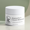 White jar of Botanical No. 6 | Volcanic Mineral Scrub with minimalist design on a light green and beige background, showcasing eco-conscious luxury botanical skincare by lg apothecary co.