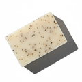 Handcrafted Peppermint Leaves botanical soap bar from LG Apothecary Co, showcasing a creamy, dense texture with visible organic peppermint leaves, resting on a clean surface.