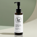 Bottle of Omega 6-9 Glowing Skin Body Oil by lg apothecary co, featuring a pump dispenser and minimalist white label, presented on a soft green and beige background.